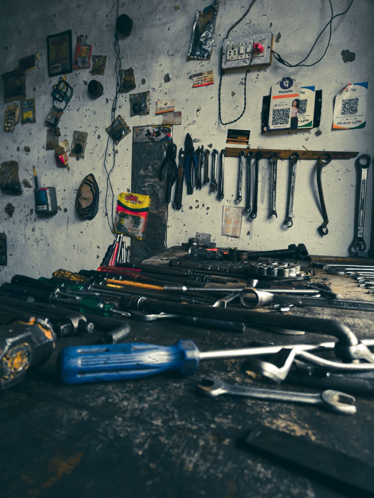 Assorted hand tools laid out on a workbench