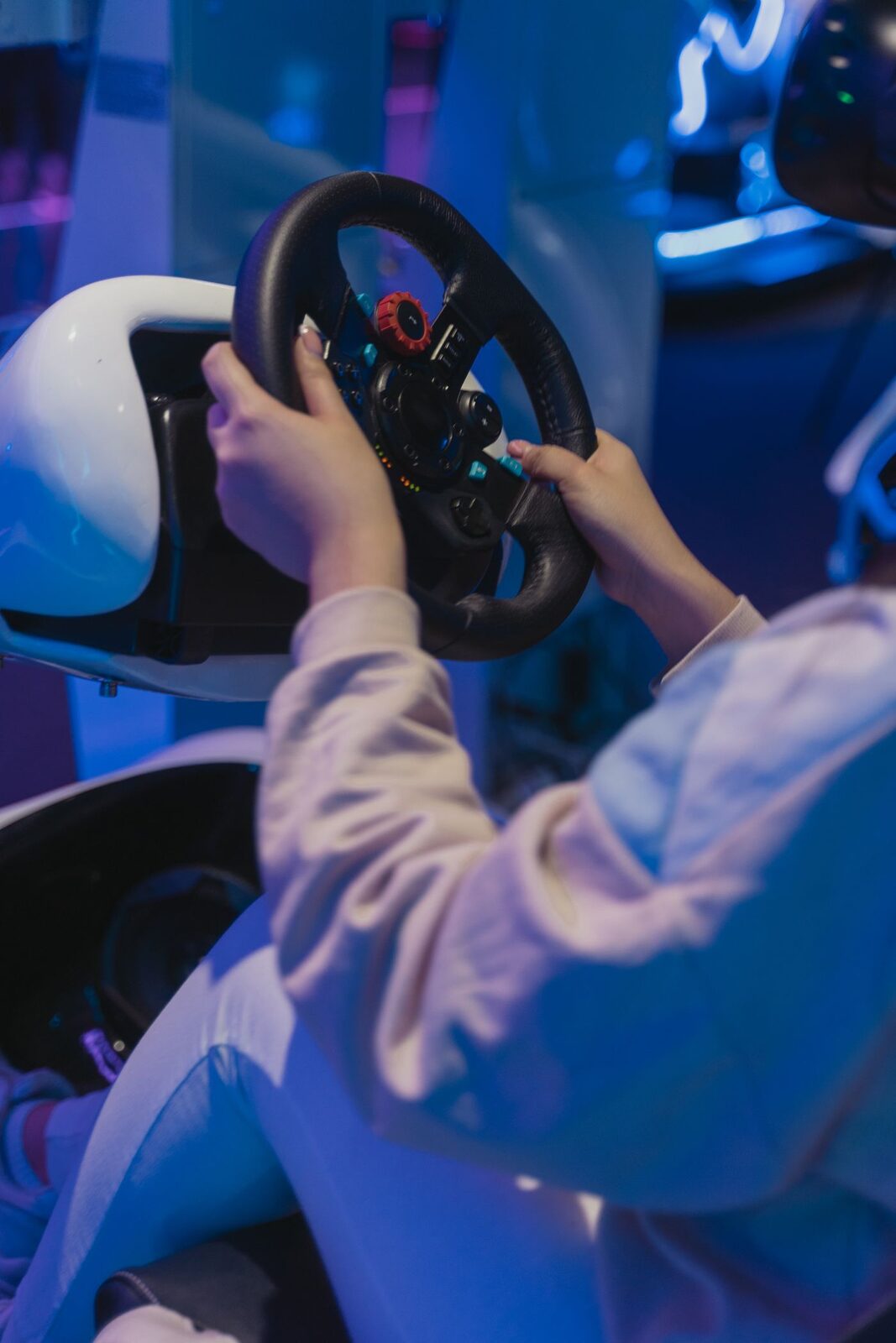 Close-up of hands gripping a sim racing steering wheel